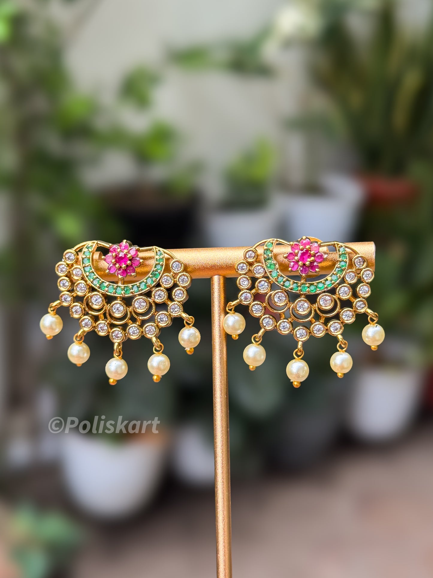 Flower ruby design with green and white stone worked jhumka set