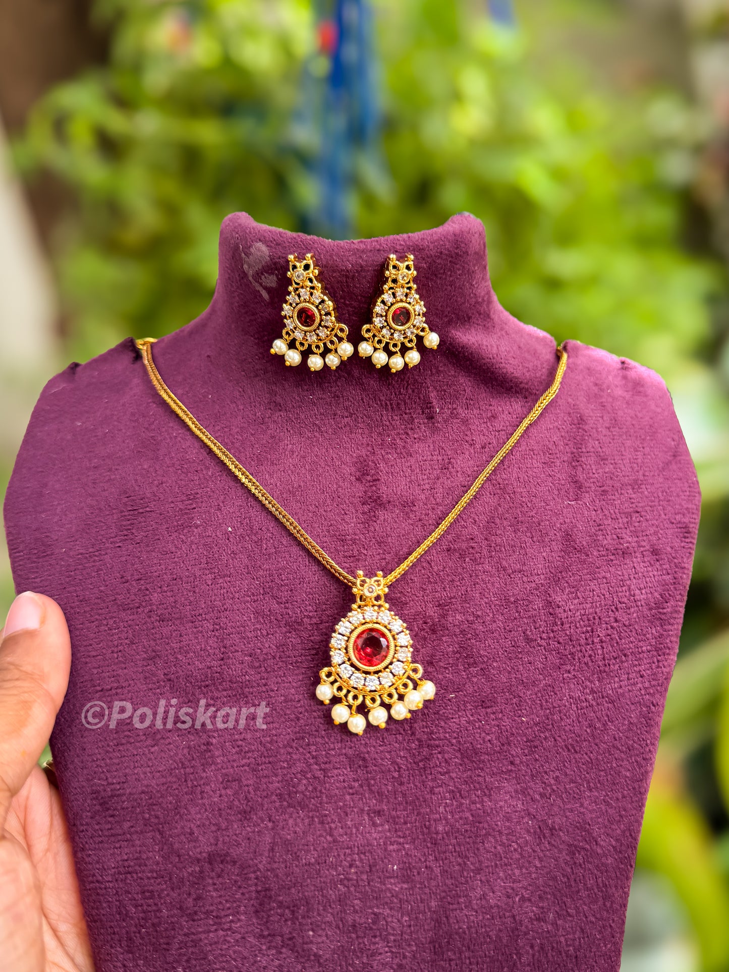 Ruby and white stone worked with earing