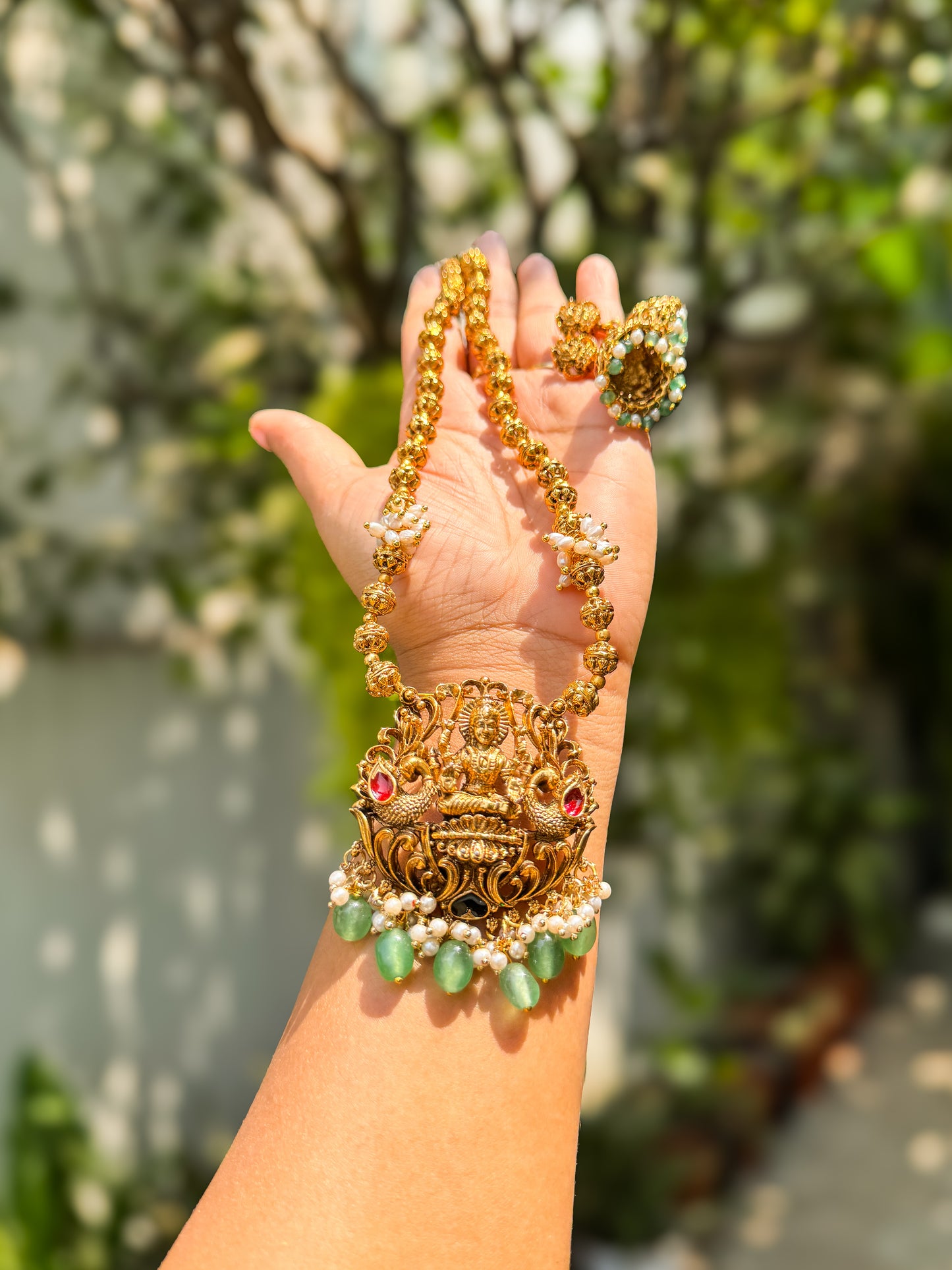 White pearl highlighted Lakshmi Haram with jhumka set