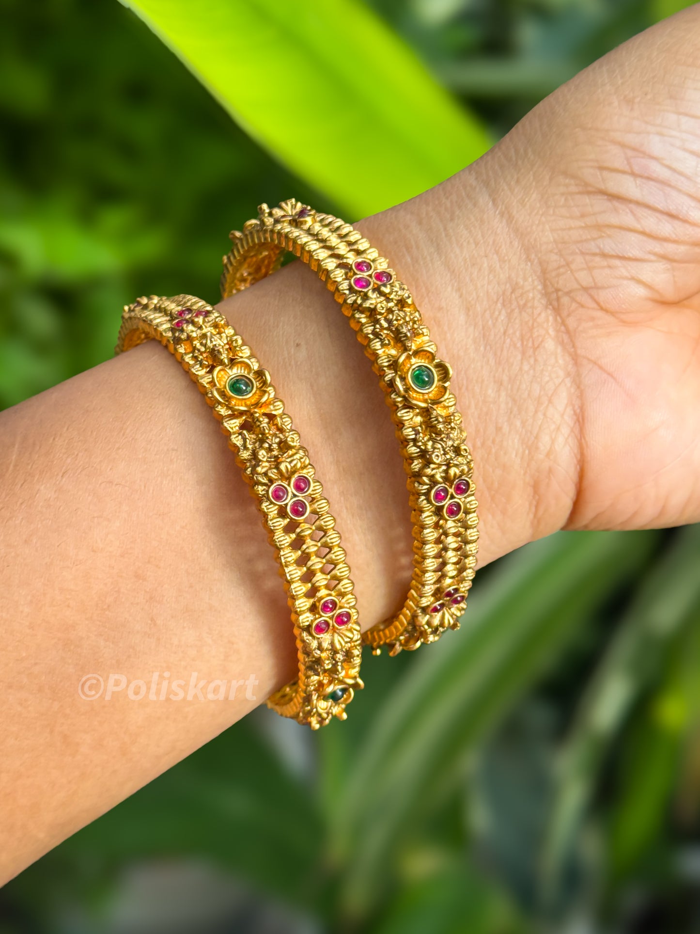 Pair of bangles Lakshmi and stone worked Design
