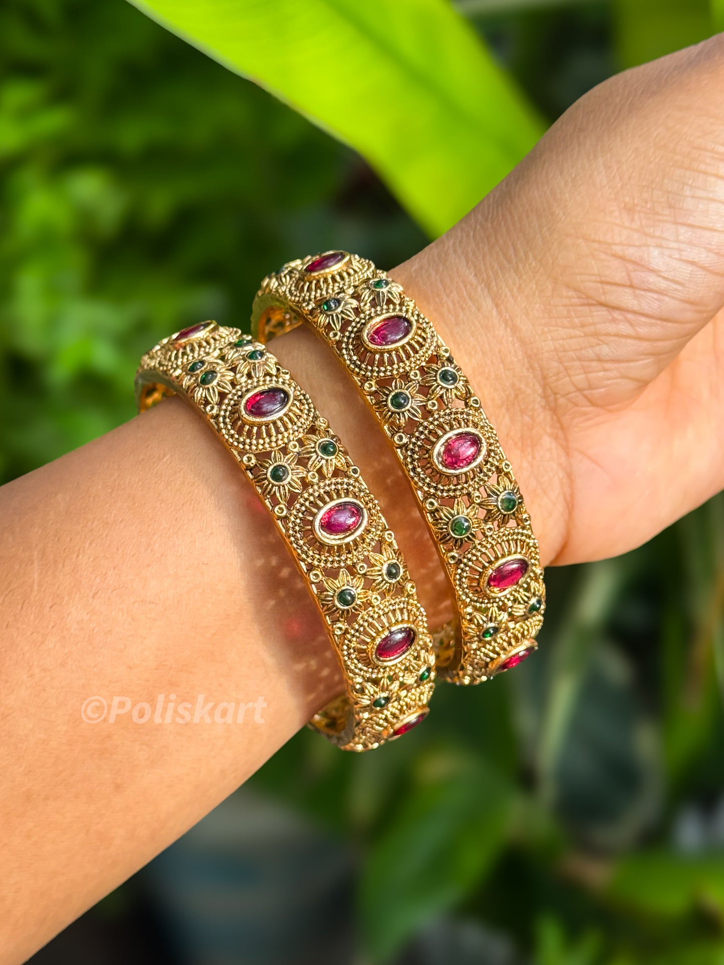 Pair of bangles Ruby and Green stone worked Design