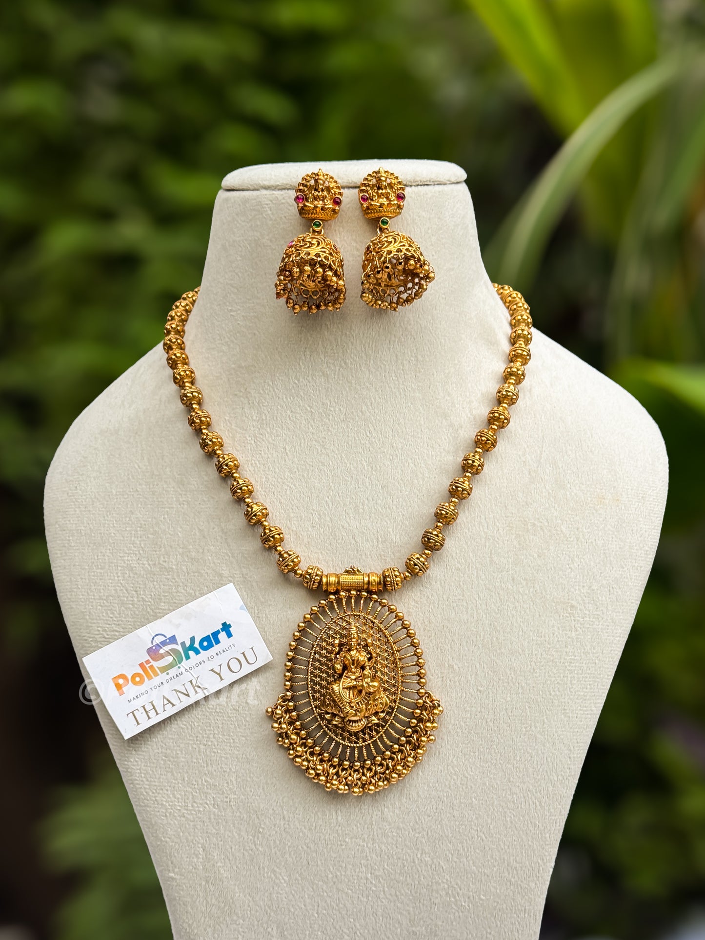 Gold finished lakshmi short haram with jhumk set