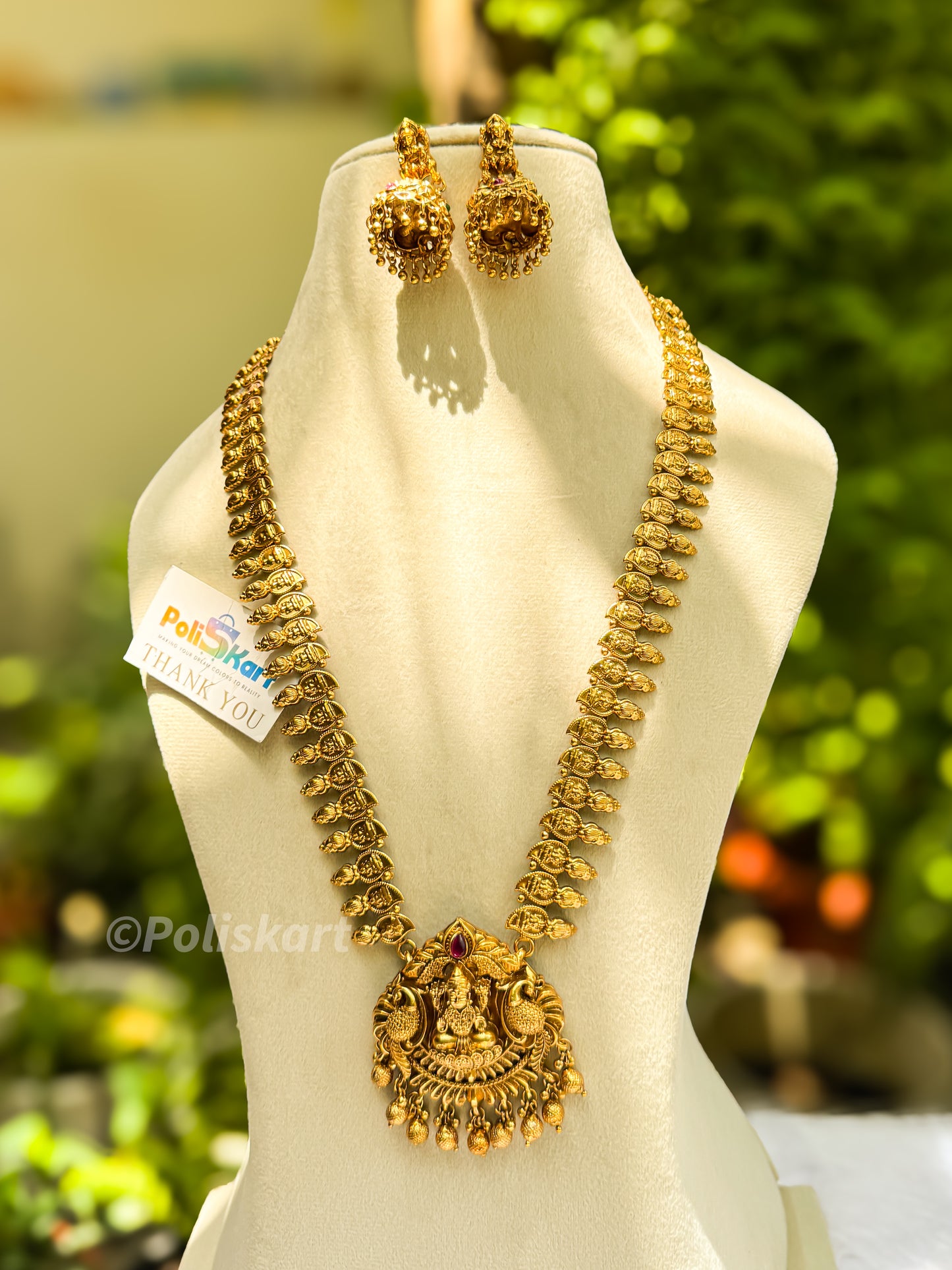 Gold finished mango designed lakshmi haram with jhumka