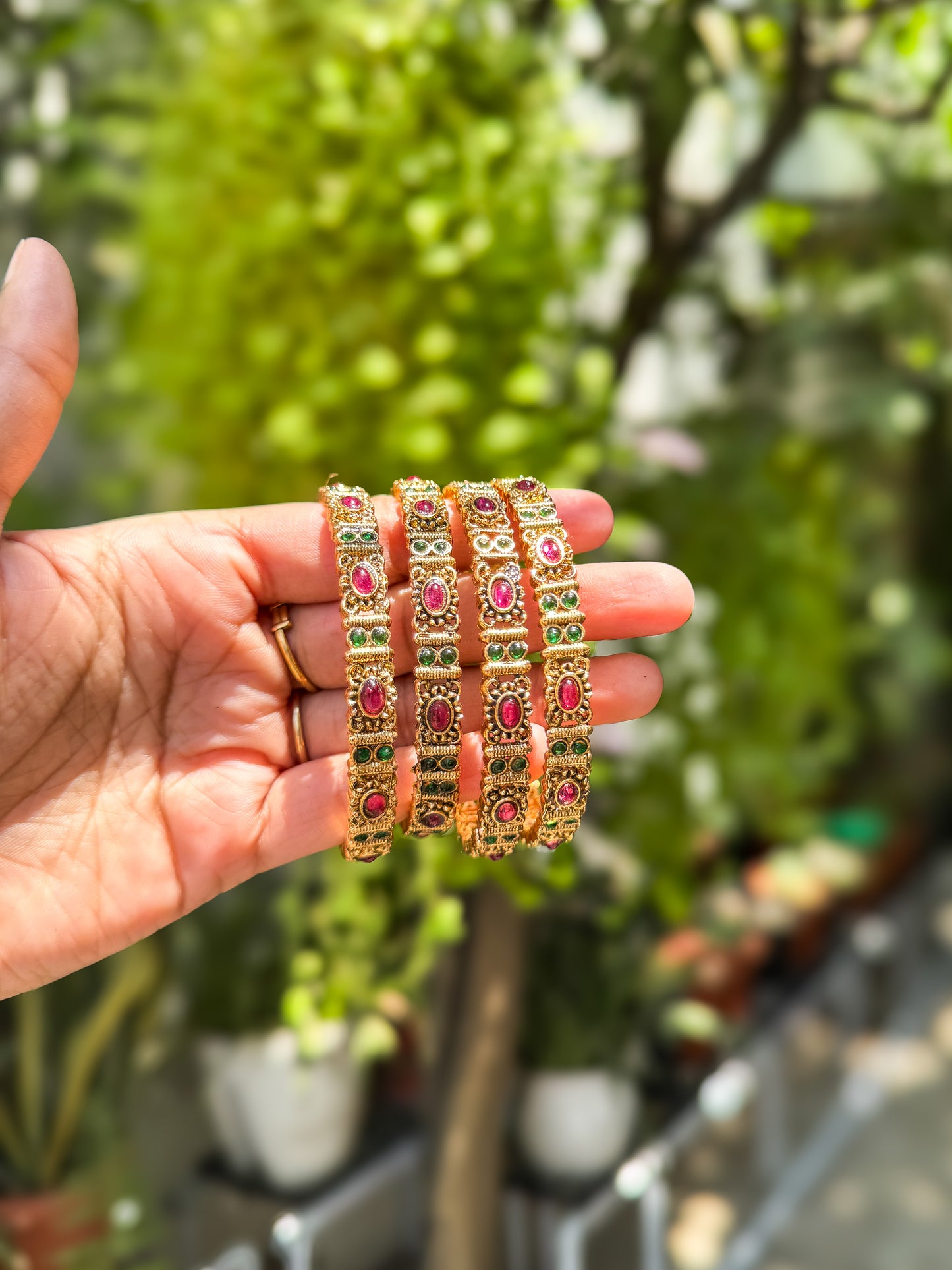 4 bangles with Green and red stone worked design