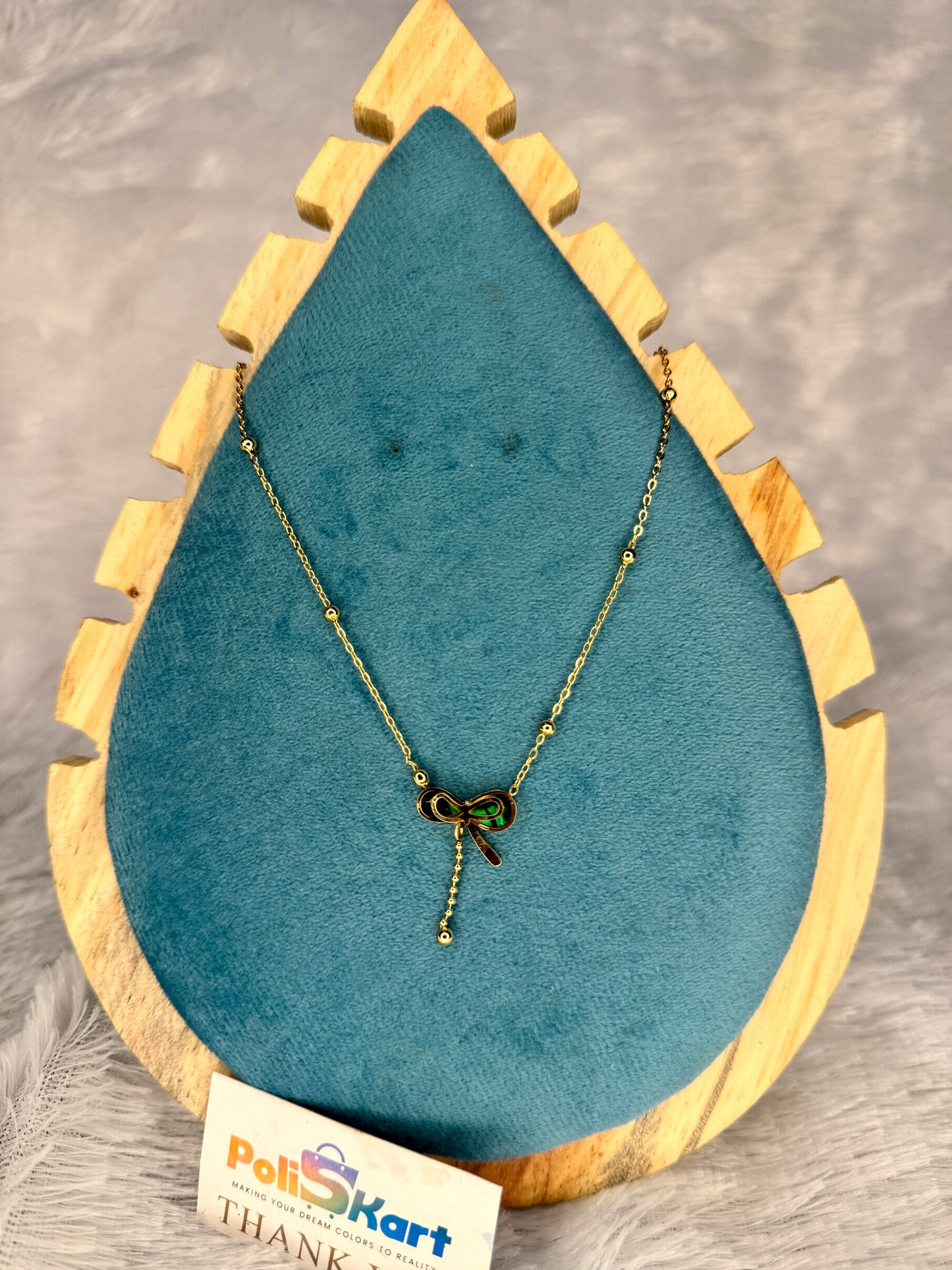 Chain with green bow pendant