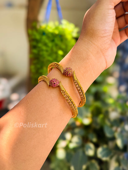 2 premium god finished bangles with rubi stone worked design