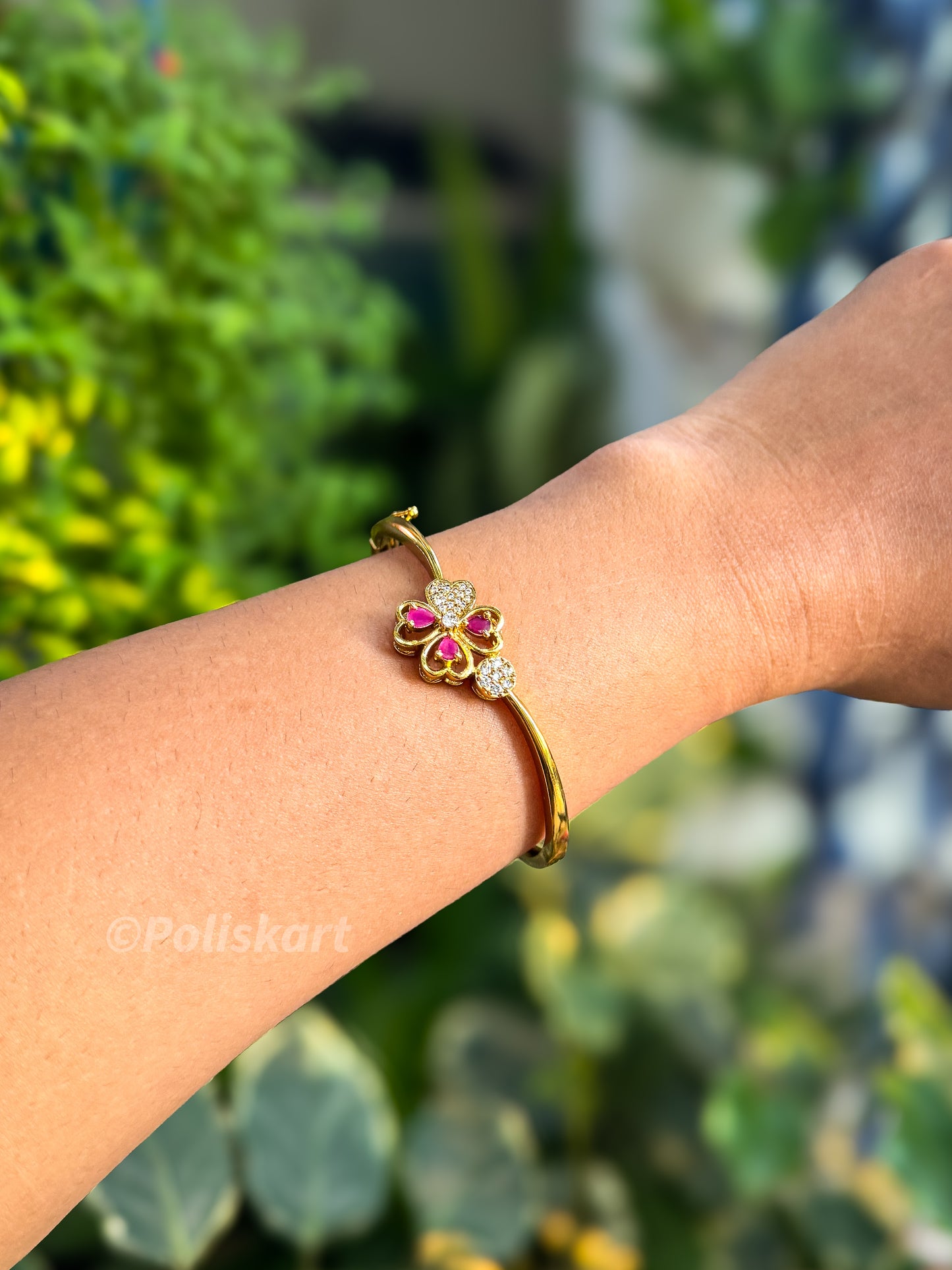 Free size bracelet bangle with white and red stone worked flower design