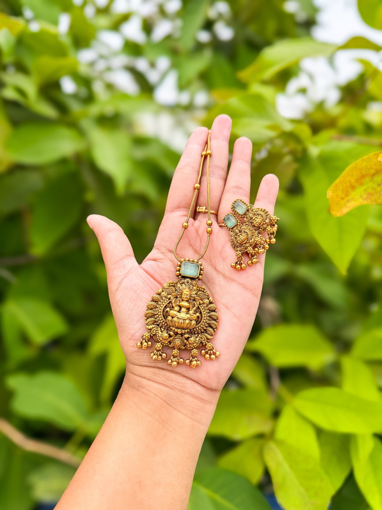 Emerald green stone worked Lakshmi chain with earring set
