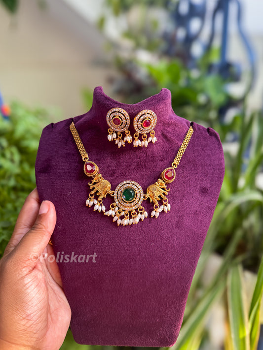 Simple pearl and elephant highlighted necklace with earring set