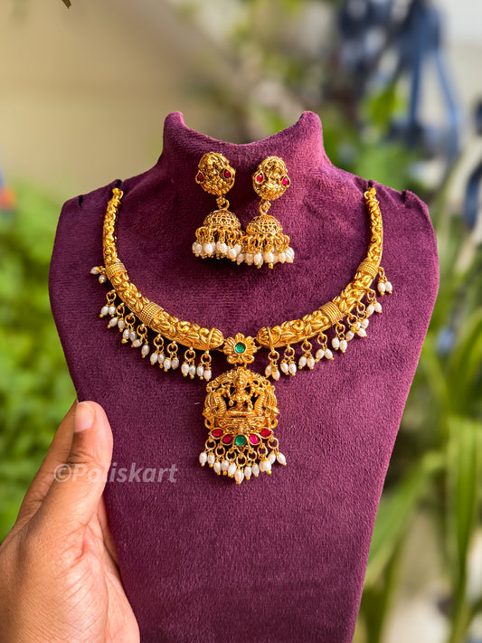 Pearl highlighted lakshmi necklace with jhumka set