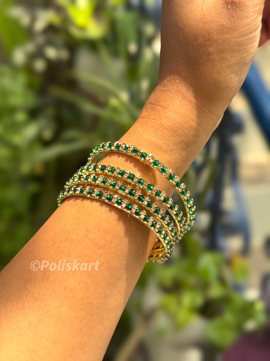 4 Green stone worked metal bangles