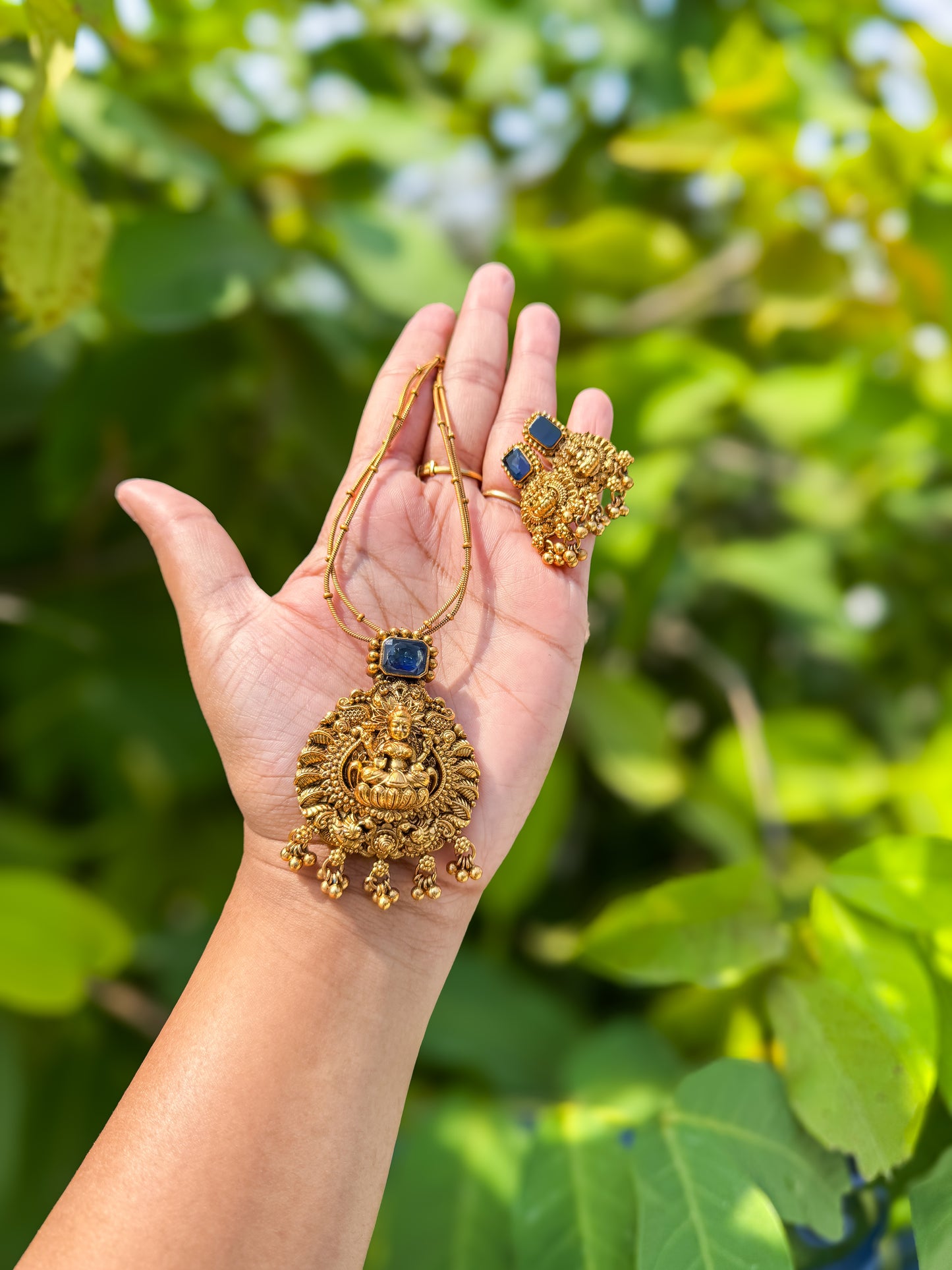 Simple chain with worked Lakshmi pendant and earring set - Dark blue color