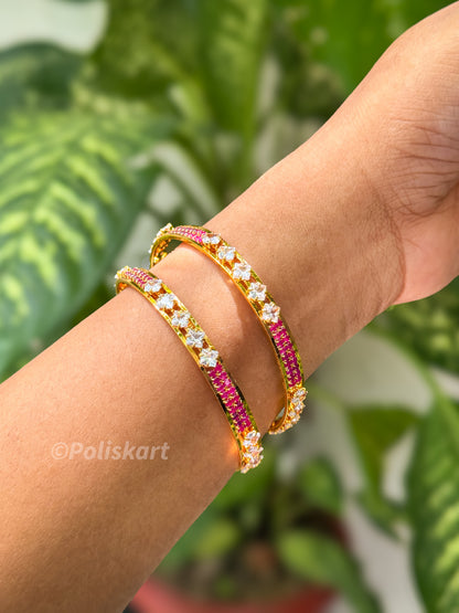 Pair of premium bangles with rubi and white stone worked