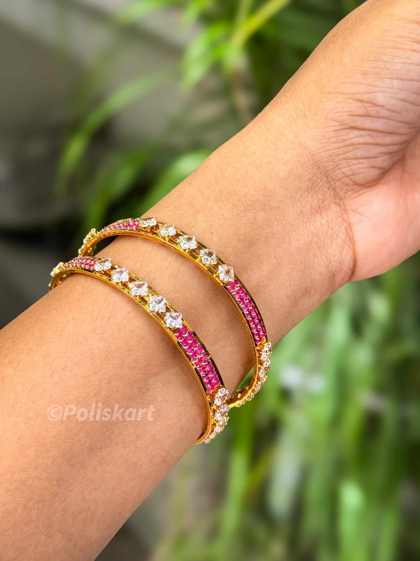 Pair of premium bangles with rubi and white stone worked