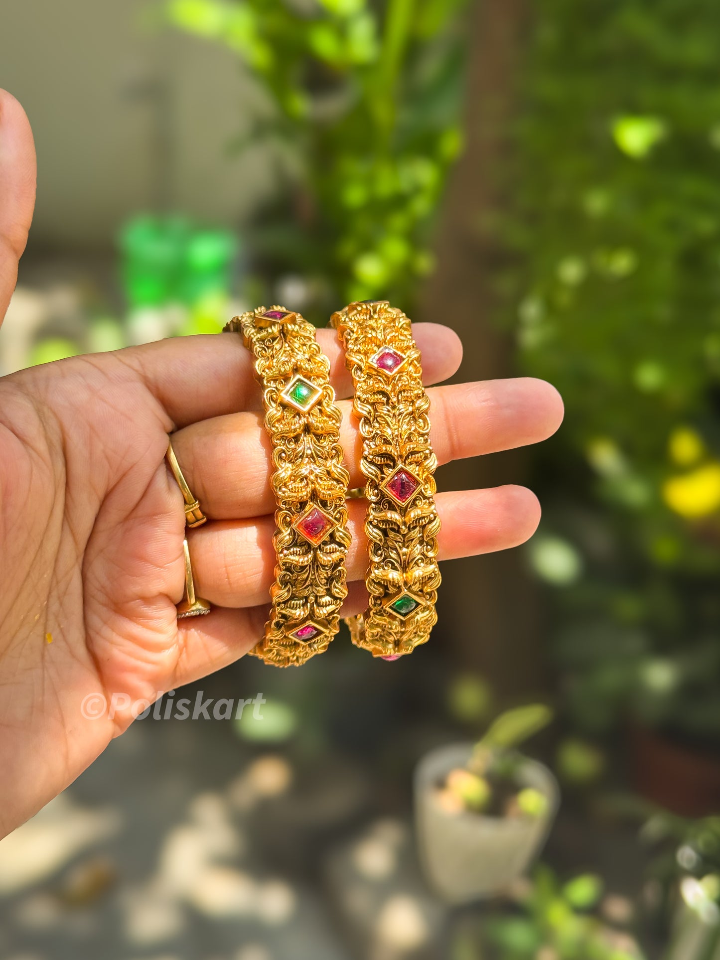 Pair of Green and rubi stone worked bangles
