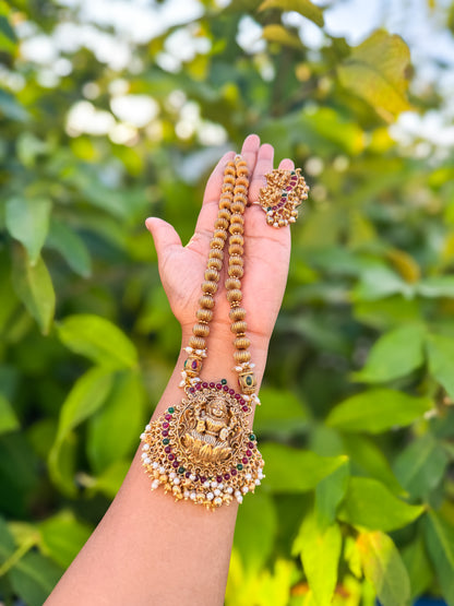 Red and green stone worked Lakshmi  haram with earing set