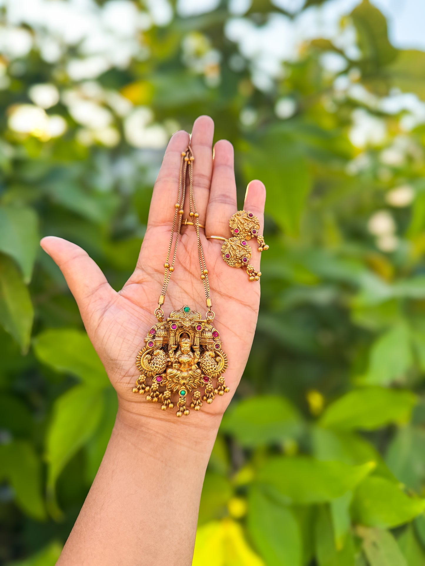 Double chain with Ruby stone worked lakshmi pendant with earing
