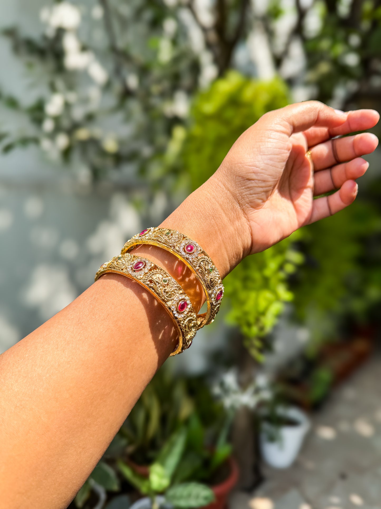 Pair of Peacock and stone worked bangles