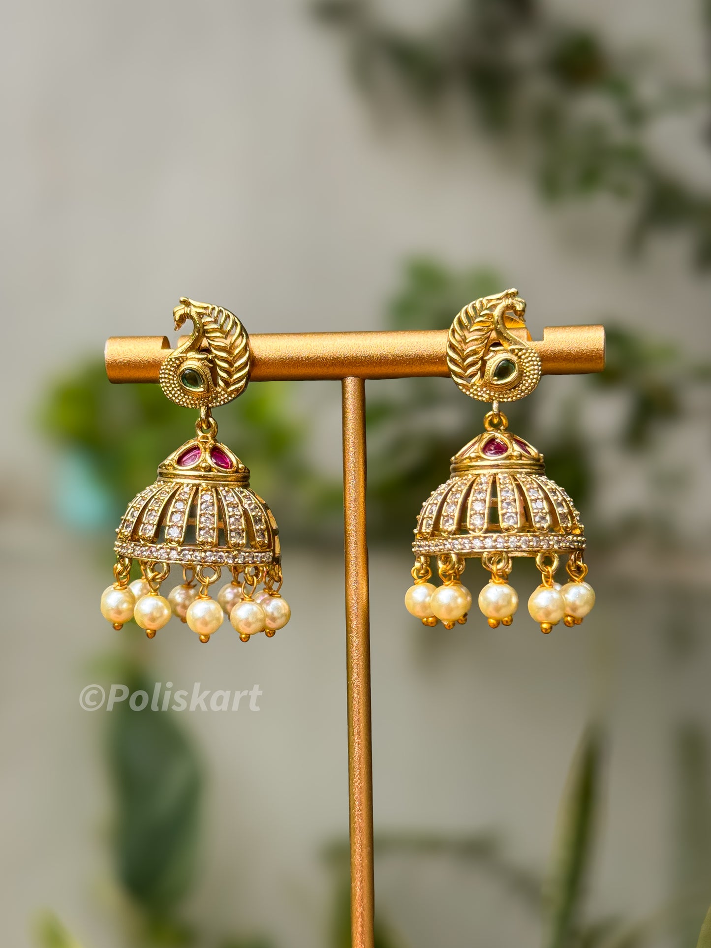 White stoned worked green and ruby peacock jhumka set