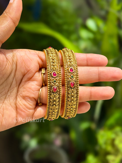 2 bangles with rubi stone worked design `