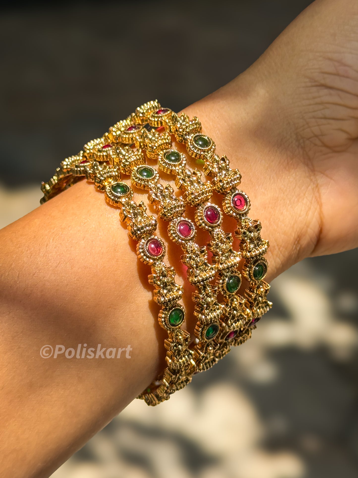 4 bangles with multi stone and lakshmi worked design `