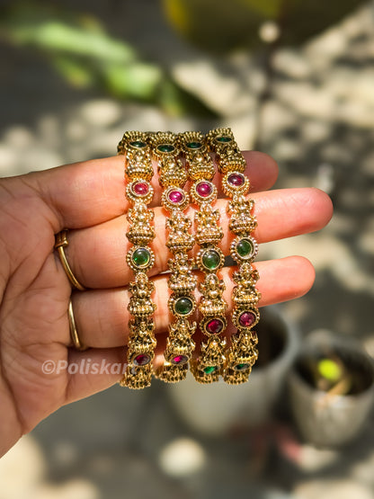 4 bangles with multi stone and lakshmi worked design `