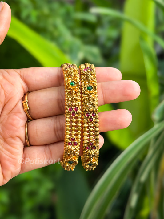 Pair of bangles Lakshmi and stone worked Design