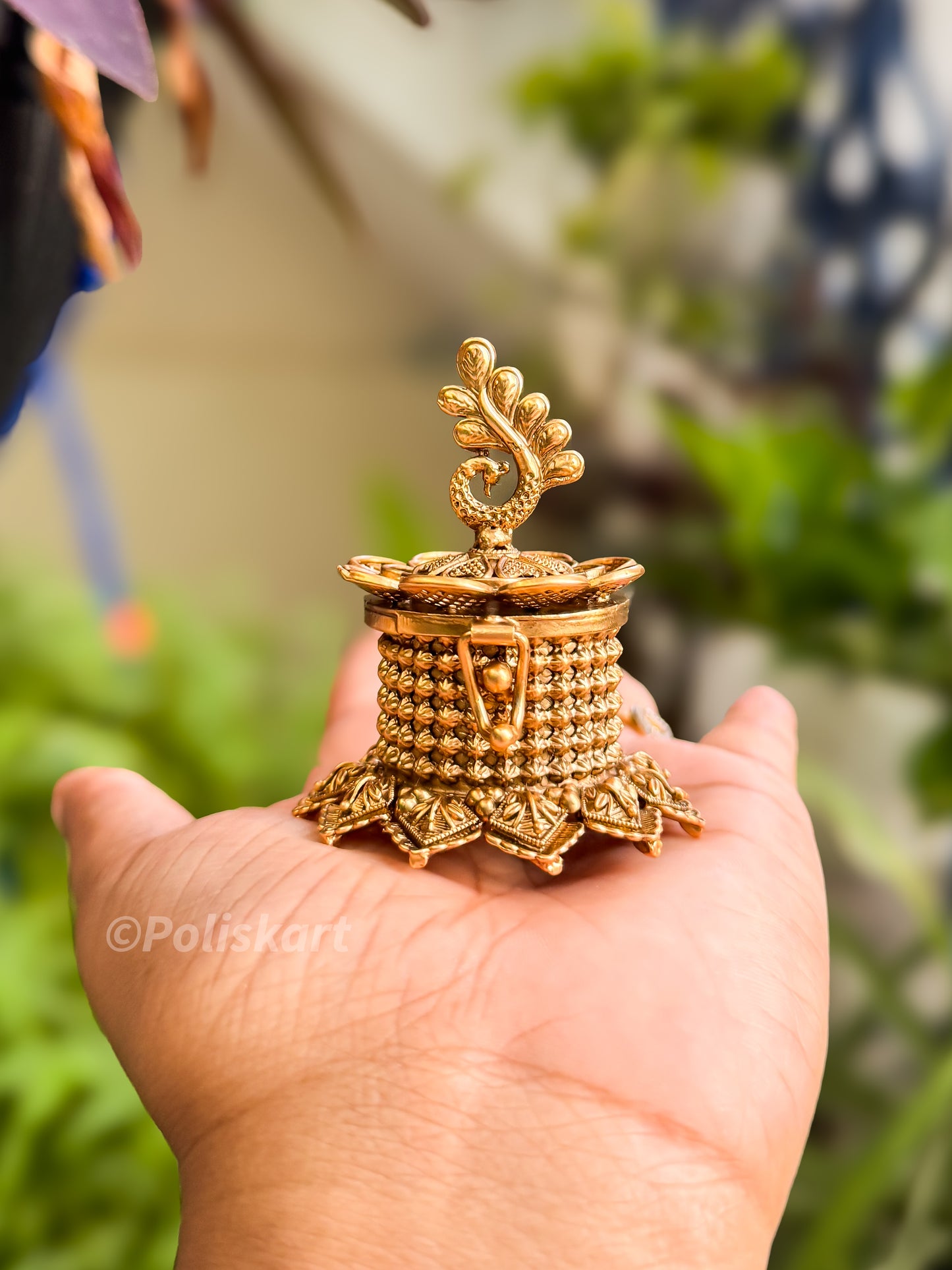 Elegant kumkumacheppu with peacock design