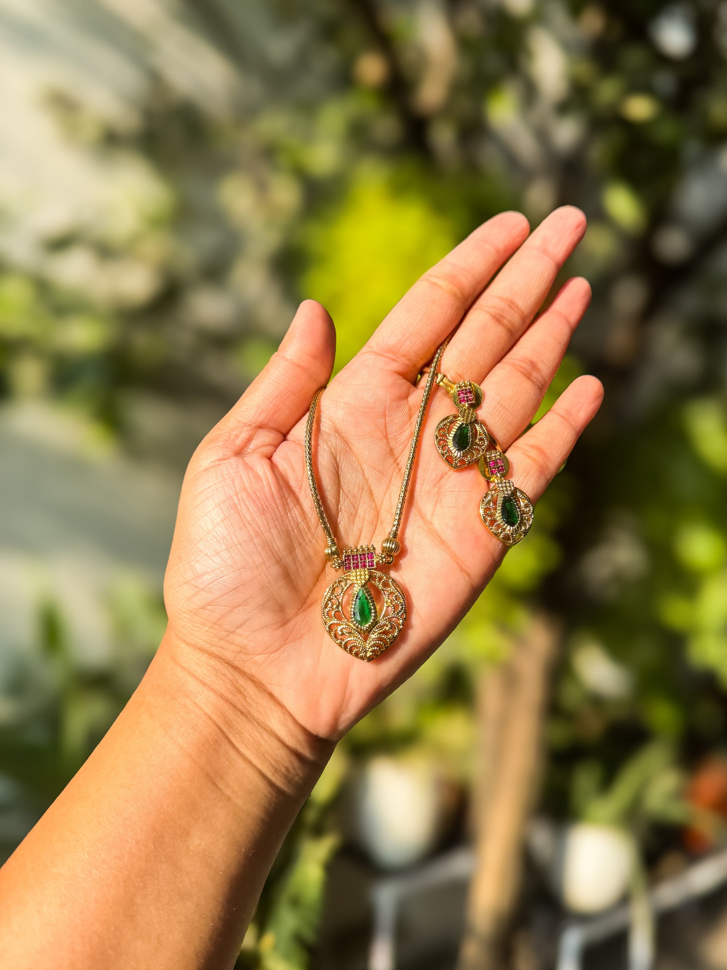 simple and Short green stone highlighted attigai with earring set