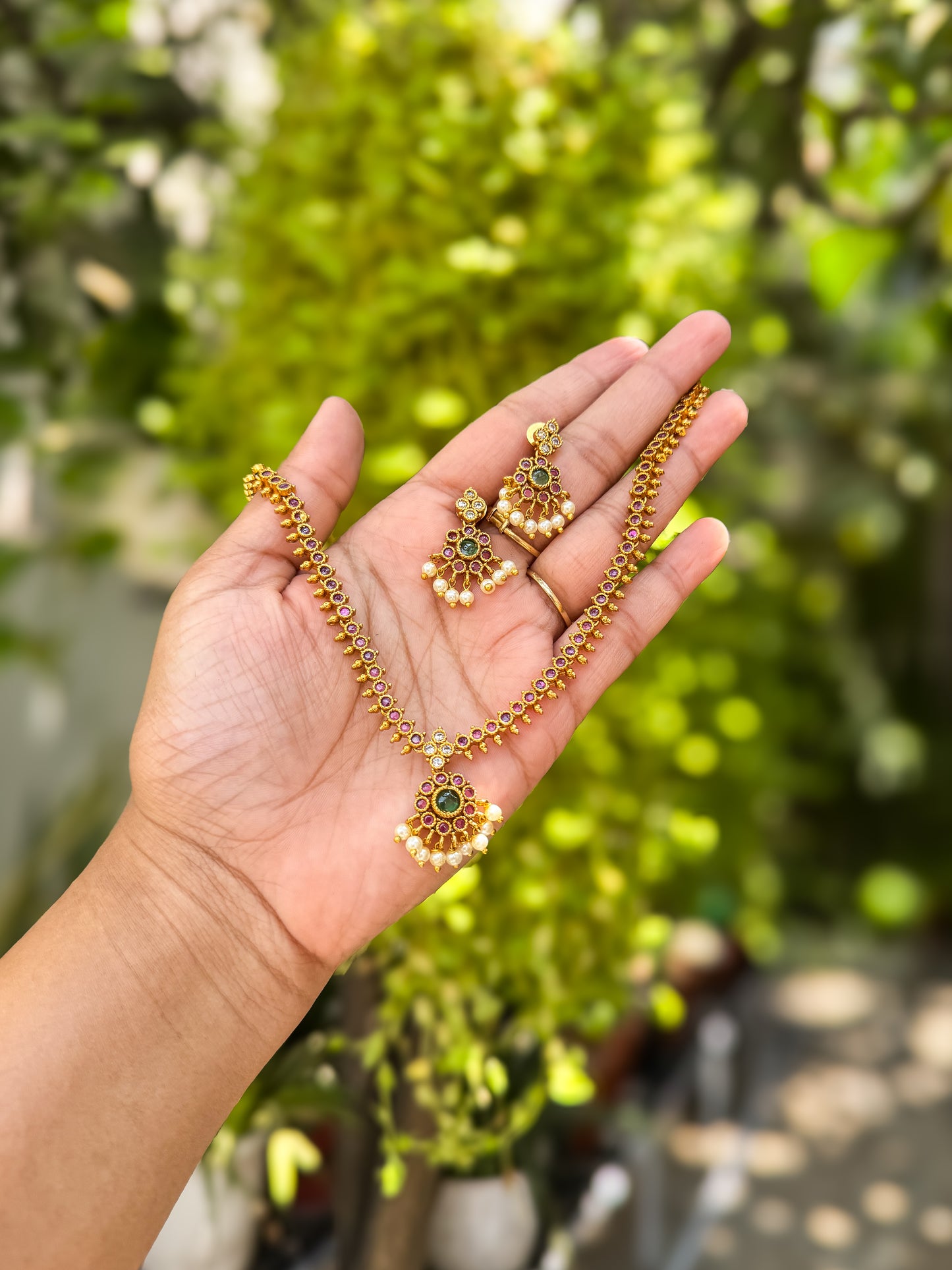 Rubi and green stone worked attigai necklace with earring set