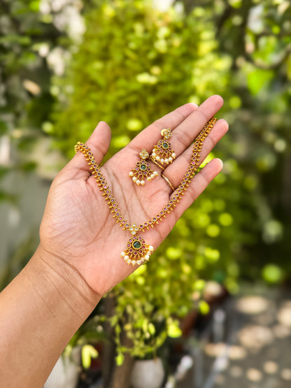 Rubi and green stone worked attigai necklace with earring set