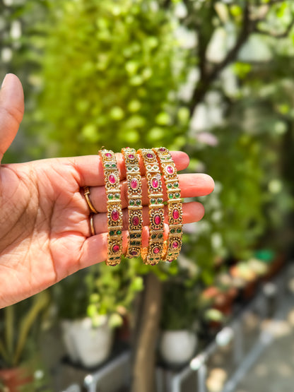 4 bangles with Green and  red stone worked design