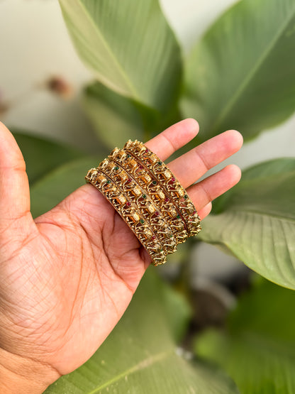 4 bangles with small elephant worked design