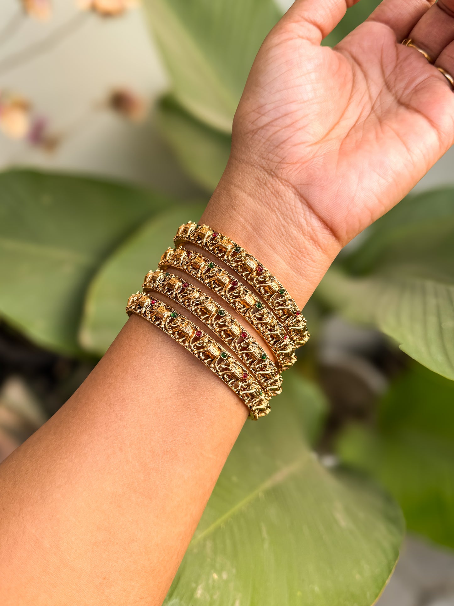 4 bangles with small elephant worked design