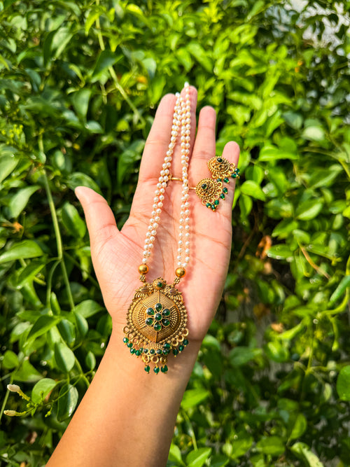 White Pearl Detailed chain having Green stone worked Pendant withearring set