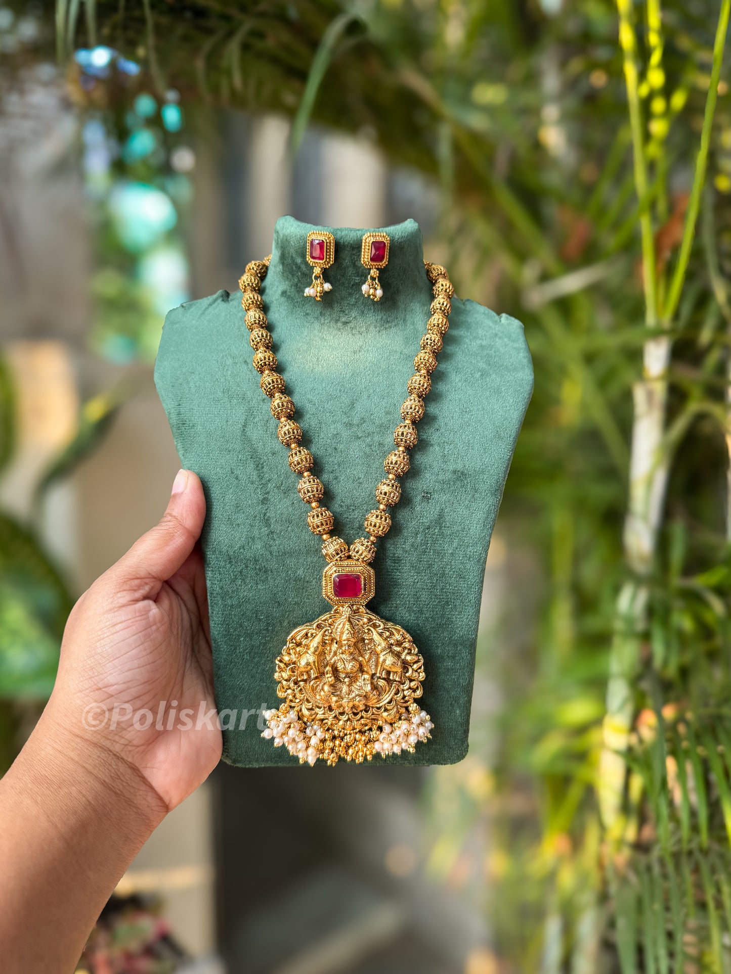 Gold finished Lakshmi short haram and earring set