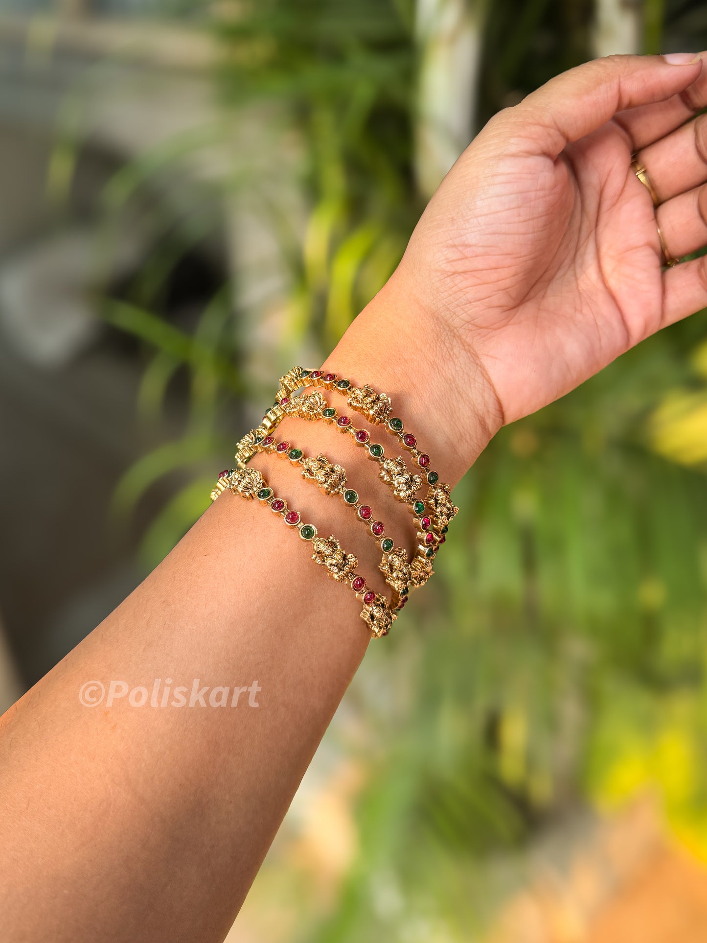 4 Emerald and rubi stone worked lakshmi bangles