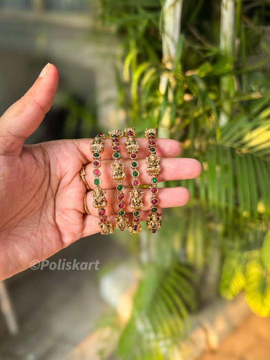4 Emerald and rubi stone worked lakshmi bangles