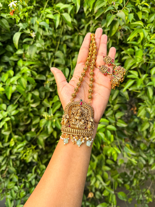 Elegant Lakshmi haram with emerald green highlighted and earring set