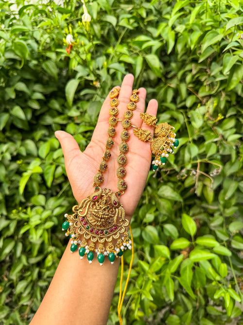 Elegant Lakshmi haram with rubi green highlighted and earring set