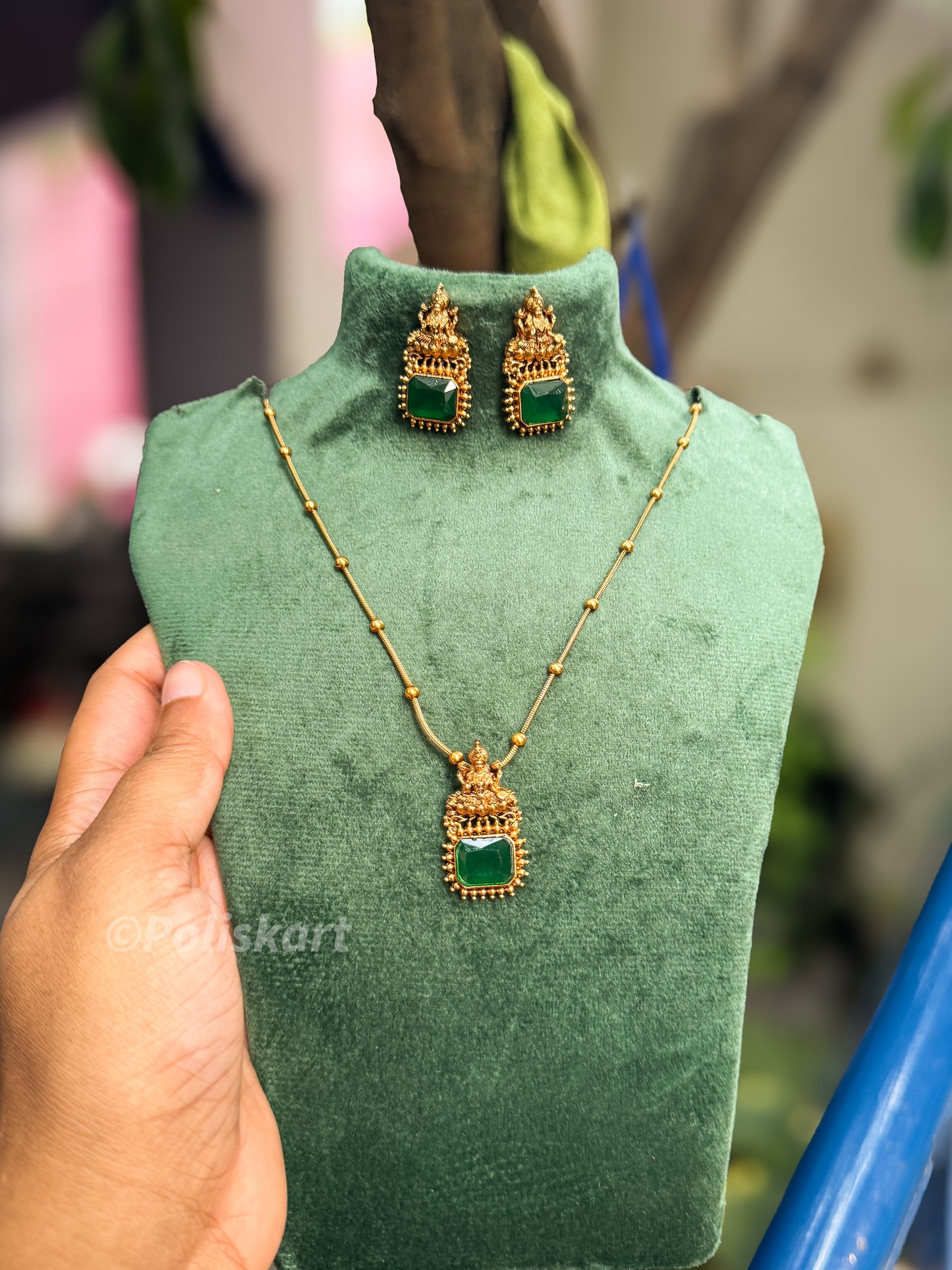 Simple single green stone lakshmi pendant with chain and earring set