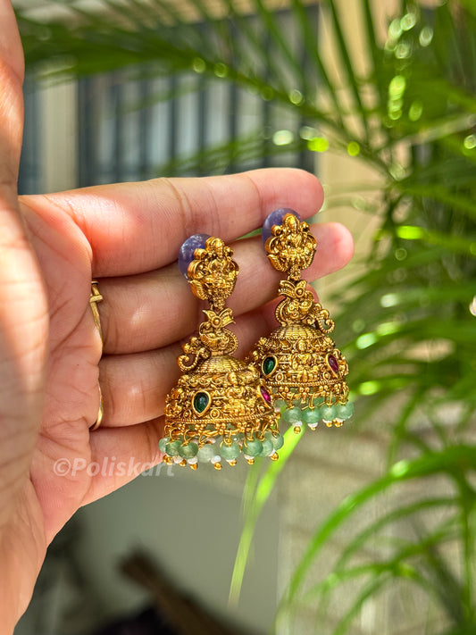 Emerald stone highlighted jumka set