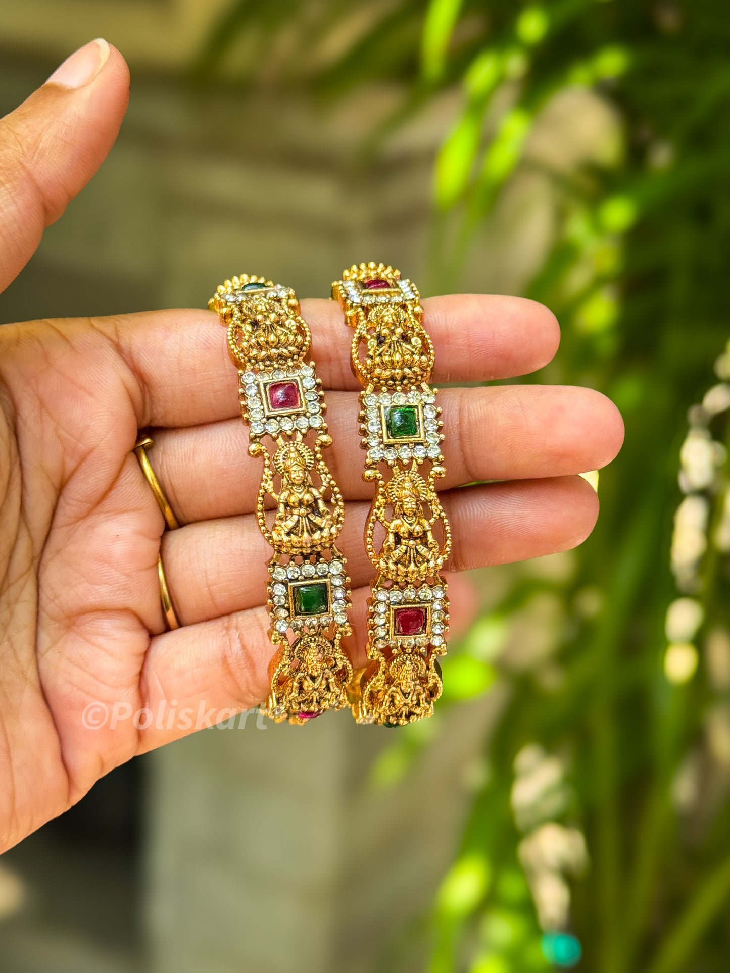 Pair of Laxmi and stone worked bangles
