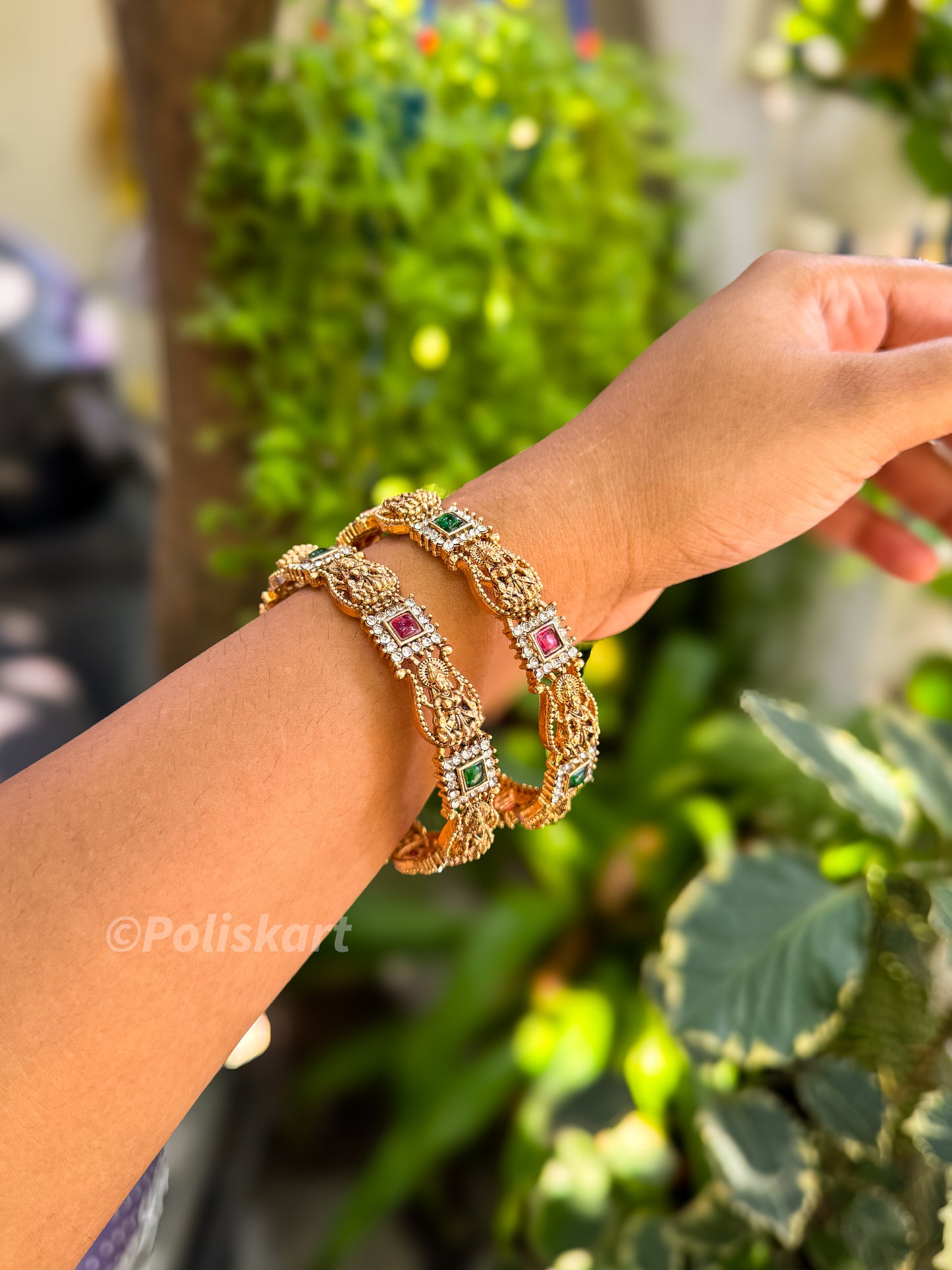 Pair of Laxmi and stone worked bangles