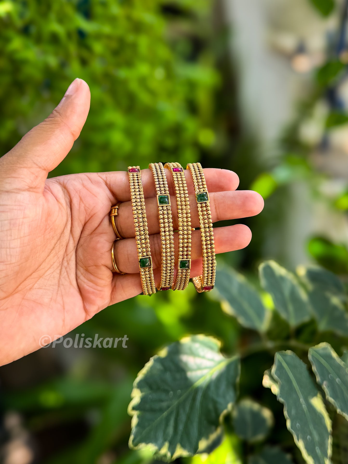 4 bangles with gold finished design